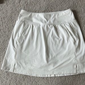Travis Mathew White Skort in size S.